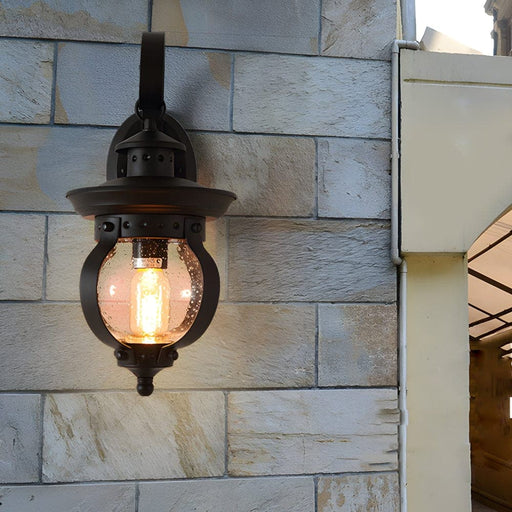 Elegant Matte Black Outdoor Wall Light with Seeded Glass Shade and Curved Arm, High-Quality Iron and Art Glass Lantern for Timeless Charm-ErisView-1